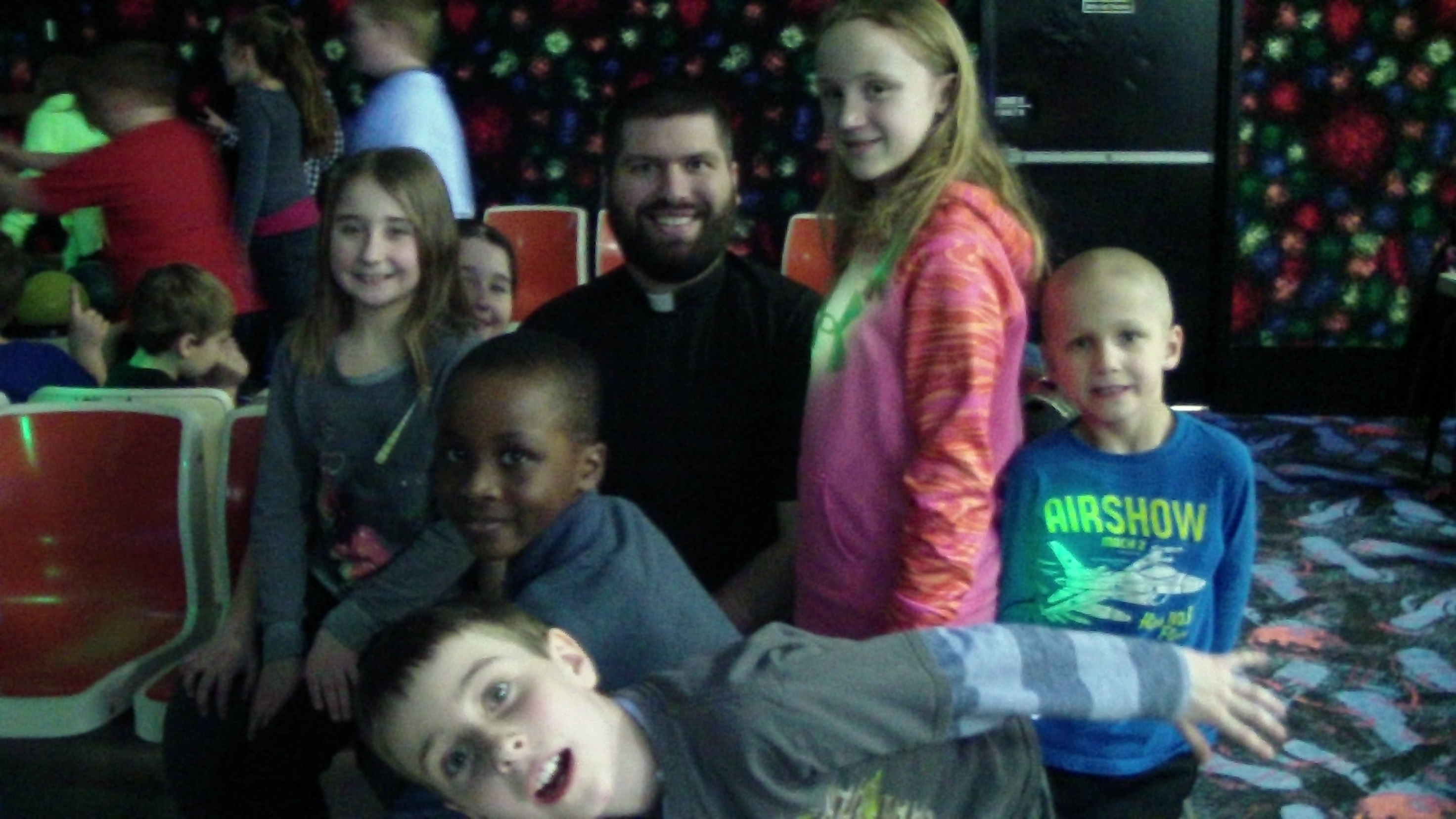 Bowling with Fr. Naples during winter activities Friday.