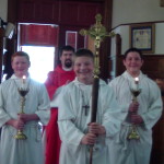 Altar servers Connor, Sam and Nick with Fr. Naples.